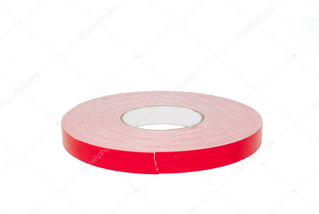 Double sided sticky tape reel. Red ribbon Roll isolated on white background. High quality photo