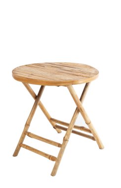 Round natural teak garden table isolated on white background. Folding bamboo table. High quality photo