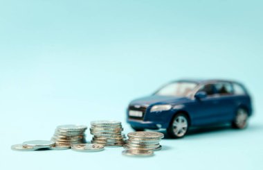 Kyiv, Ukraine. December 1, 2020 Blur Car SUV on coins background : Car loan, Finance, saving money, insurance and leasing time concepts