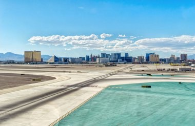 View of McCarran International Airport tarmac though airplane window.