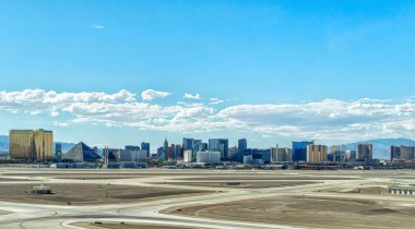 View of McCarran International Airport tarmac though airplane window.