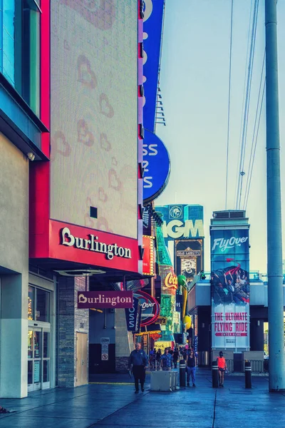 Las Vegas, Nevada, USA - August 01, 2022: Street scene downtown Las Vegas. Historic, colorful neon signs hang above near the popular Fremont Street Experience. Millions visit Las Vegas yearly.