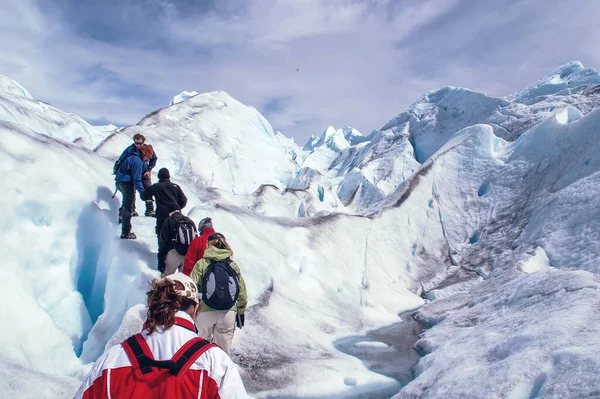 Tourists trekking on Perito Moreno Glacier in Los Glaciares National Park near El Calafate in Argentina, Patagonia, South America.