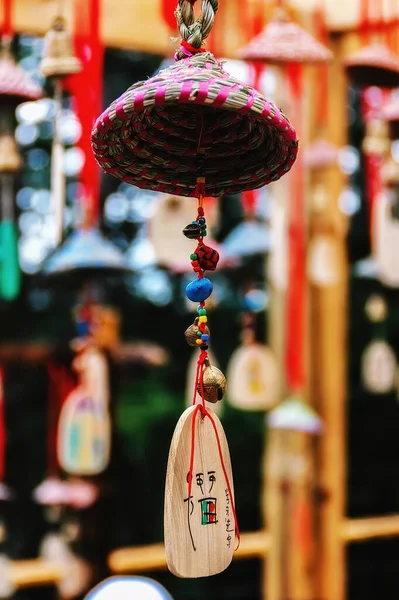 Lijiang, Yunnan - 25 August 2007: Hanging sign for pray at Lijiang Old Town in Lijiang Yunnan, China