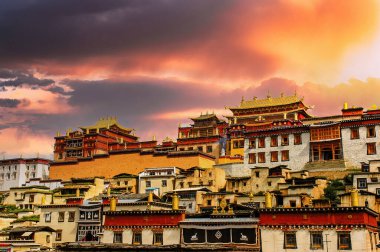 Little potala or tibetan monastery in Shangrila old town of Zhongdian , Yunnan , China - Ancient architecture building famous landmark of tibet travel clipart