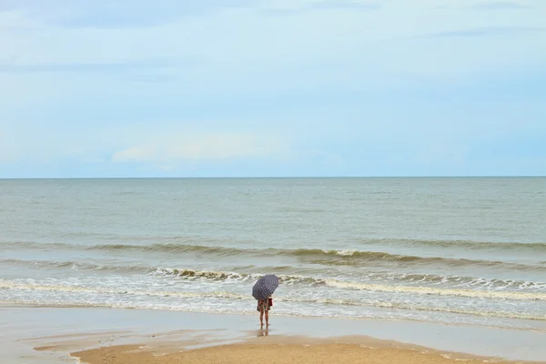 Girl on beach with umbella — Stock Photo, Image
