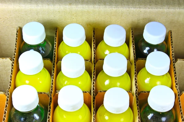 Bottles in a cardboard box — Stock Photo, Image