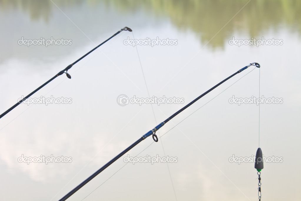 Fishing rods on riverside Stock Photo by ©sirichai2514 34621197