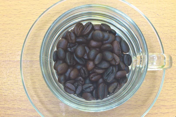 Granos de café en taza — Foto de Stock
