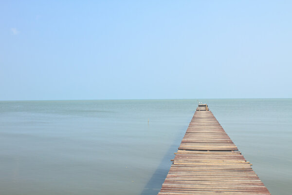 Wooden bridge into the sea