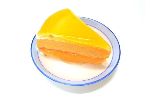 Orange Cheesecake in plate on background — Stock Photo, Image