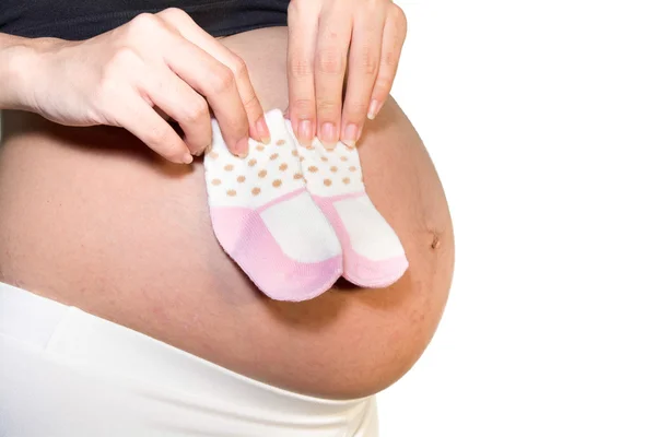 Fermer chaussette bébé sur les femmes enceintes — Photo