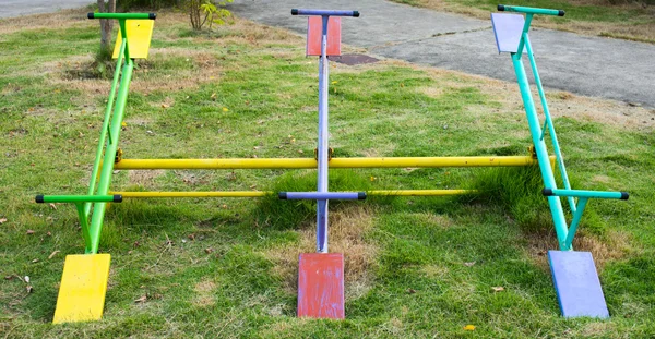 Teeter-totter en parque infantil —  Fotos de Stock