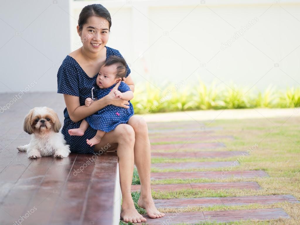 Mother is Raising children and dogs together