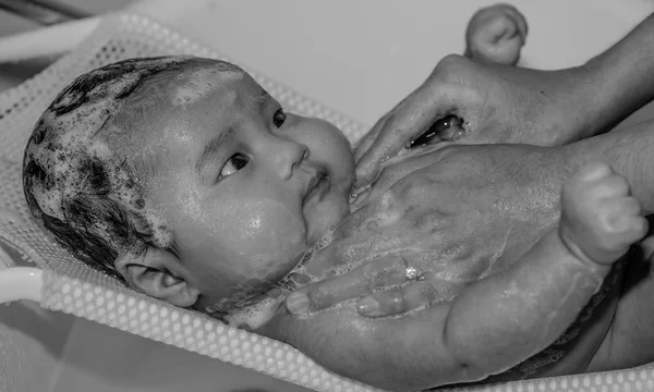 Black and white baby bathing with foam — Stock Photo, Image
