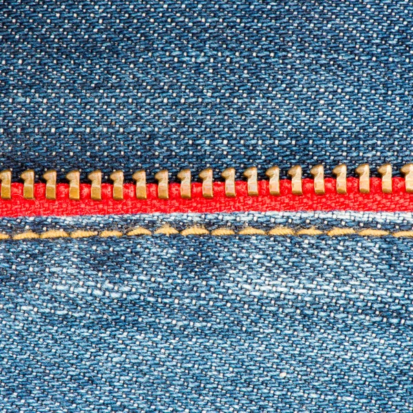 Jean Textur aus Baumwolle mit rotem Reißverschluss Stockfoto