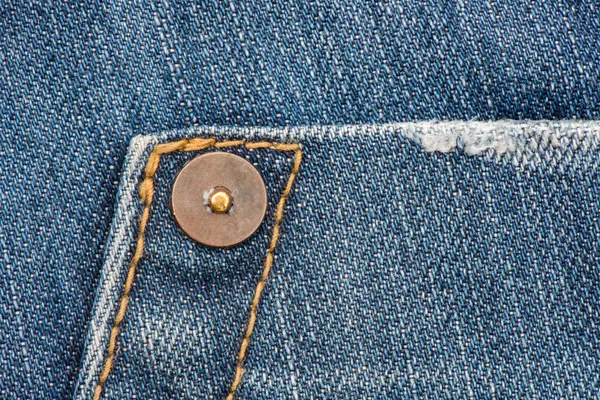Jean texture of cotton with metal button — Stock Photo, Image