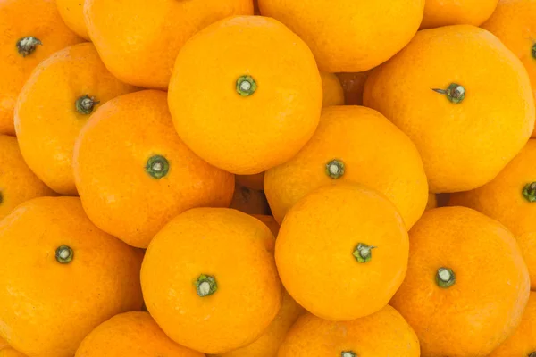 Viele frische rohe Orangen aus nächster Nähe — Stockfoto