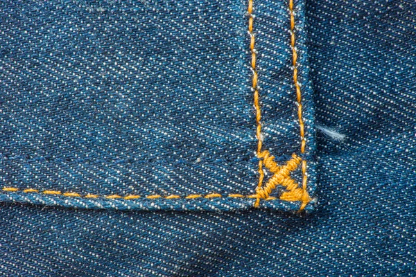 Azul denim jean y amarillo costura textura fondo — Foto de Stock