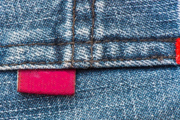 Blu Denim Jean con etichetta rossa Texture sfondo — Foto Stock