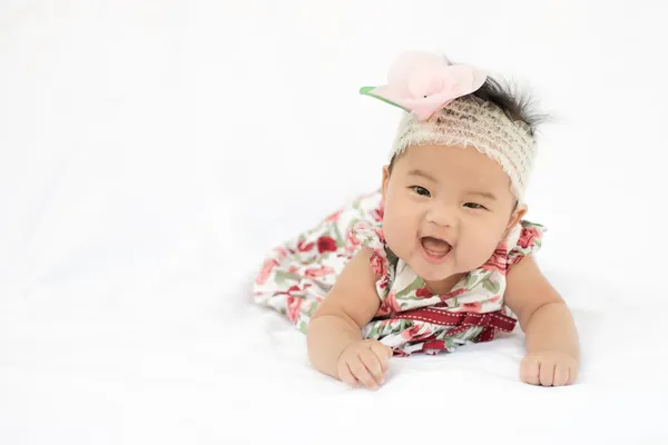Cute baby smiling girl with rose headband — Stock Photo, Image