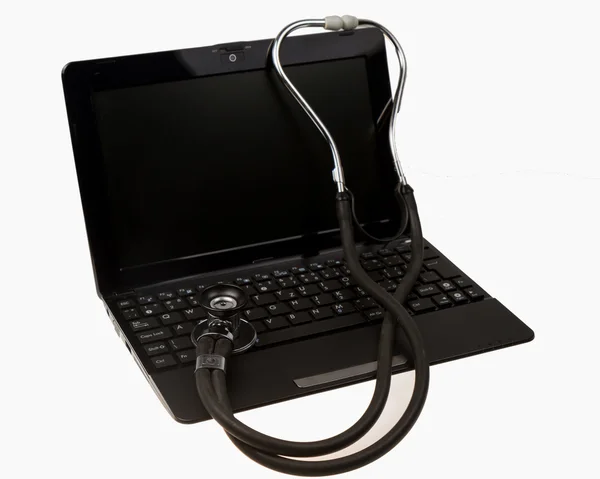 Stethoscope on notebook computer Stock Photo