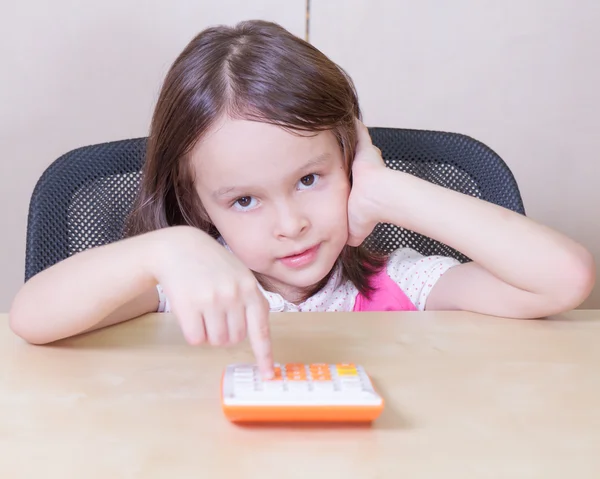 Child with a calculator — Stock Photo, Image