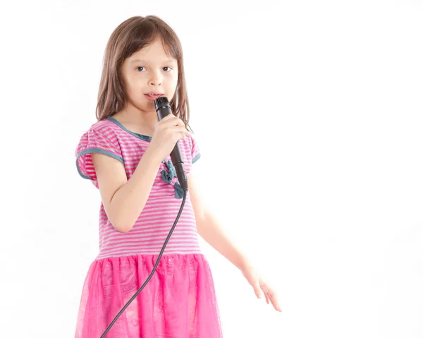 Asian girl singing with microphone — Stock Photo, Image