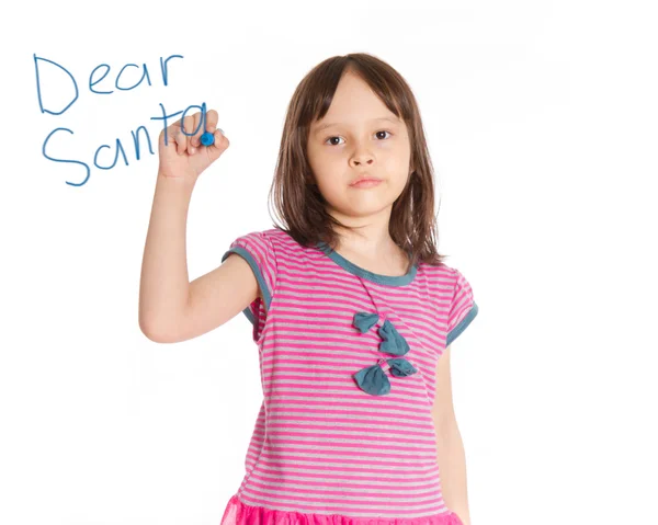 Chica joven escribiendo a Santa en tablero imaginario — Foto de Stock