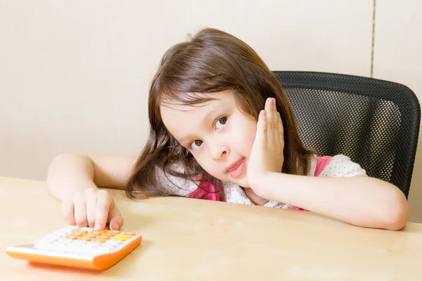 Girl with calculator — Stock Photo, Image