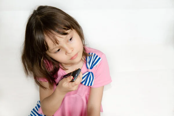 Child with a remote control — Stock Photo, Image