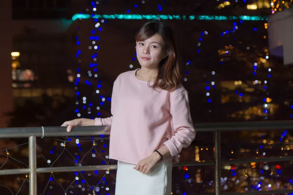 Beautiful Asian Woman with lights in Background — Stock Photo, Image