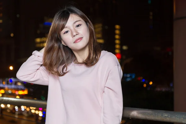 Attractive Asian Woman in front of bright LIghts — Stock Photo, Image