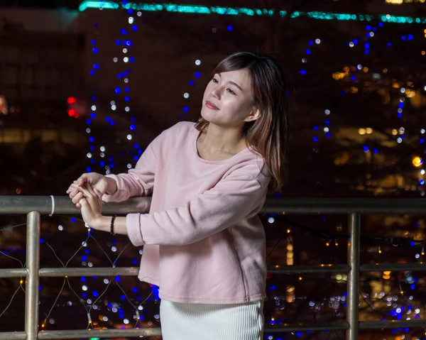 Attractive Asian Woman in front of bright LIghts — Stock Photo, Image