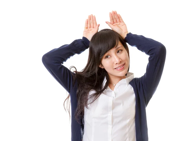 Asian woman with hands on head as ears — Stock Photo, Image