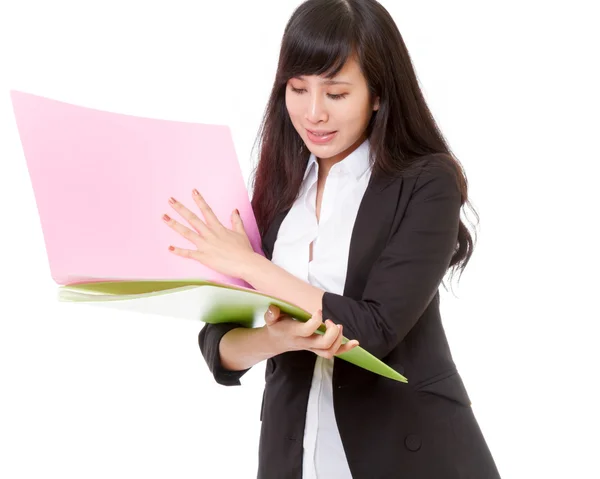 Asian businesswoman holding bright colored folders — Stock Photo, Image