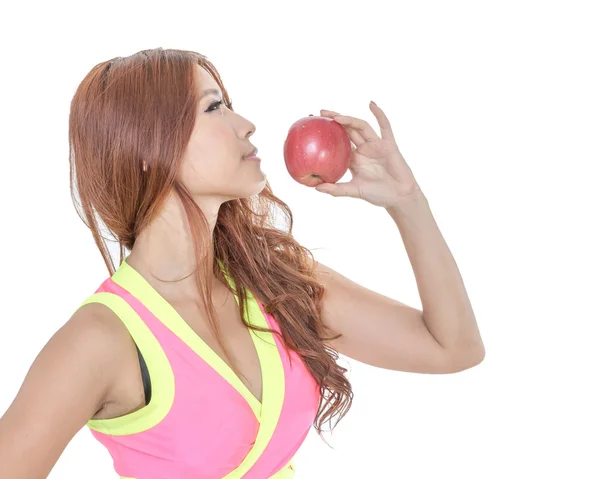 Beautiful fit Chinese woman holding an apple — Stock Photo, Image