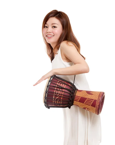 Asian woman playing a djembe — Stock Photo, Image