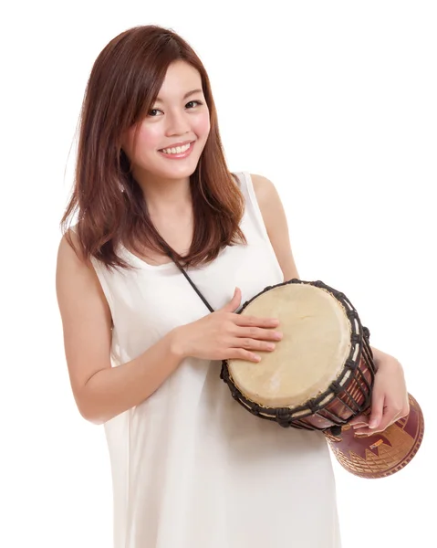 Asian woman playing a djembe — Stock Photo, Image