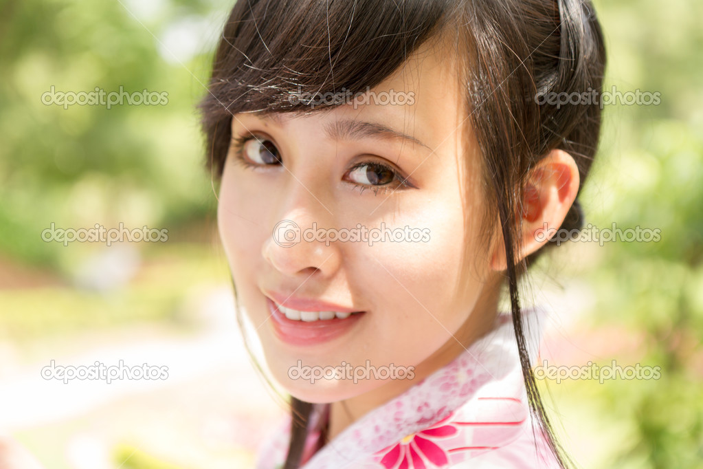Portrait of an Asian woman wearing a kimono