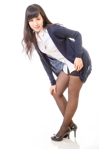 Asian woman leaning with hand on knee — Stock Photo, Image