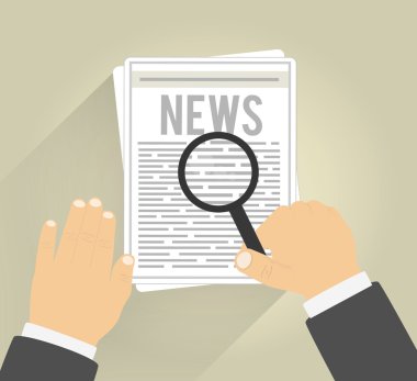 Vergrootglas met dagelijkse krant