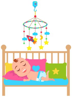 Bebek beşikte yatar ve uyur. İçinde oyuncaklar ve beşikte uyuyan çocuklar için müzik olan atlı karınca.