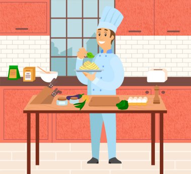 Makarna hazırlayan erkek şef, mutfakta makarna. Aşçı İtalyan mutfağını servis edip süslüyor.