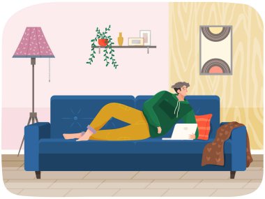 Kanepede bilgisayarla yatan, dizüstü bilgisayarı olan ve internette sörf yapan, yazı yazan bir adam.