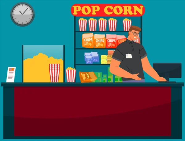 Man works in food sales department of movie house. Cinema employee sells popcorn and drinks — Stockvektor
