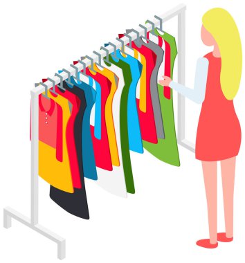 Choosing clothes in store, shopping concept. Female buyer chooses clothing in dressing room