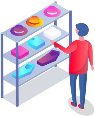 Customer choosing garments in mens clothing store. Male buyer buys hat, shirt and trousers