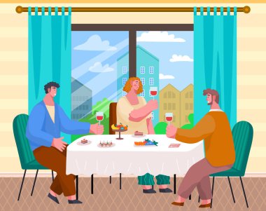 Friends sitting at table and eating in cafe. People communicate and drink wine in restaurant
