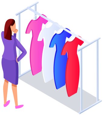 Choosing clothes in store, shopping concept. Female buyer chooses clothing in dressing room. Customer with dress hanging on hanger in mall. Woman shopper stands in fitting room of store or boutique